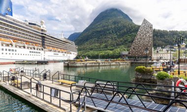 Andalsnes, Norway. Beautiful views of mountains, colorful cities and cruise ships in the arctic circle of Norway clipart