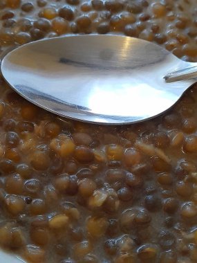 Arkaplan için kaşık ile mercimek yahnisi