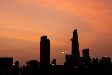 Bitexco and Landmark 81 at Sunset in Ho Chi Minh City with Saigon Bridge and Scenic View clipart