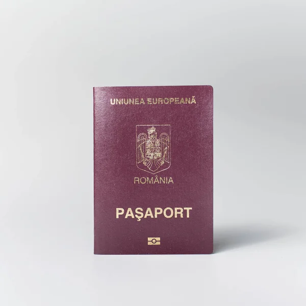 Close-up of Romanian passport isolated on white background.