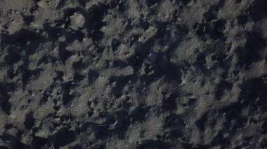 Black agriculture land. Aerial top view. Natural abstract background. Ground from another planet. Dark image.
