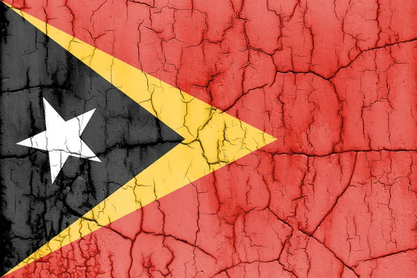 stock image Flag of East Timor on cracked wall, textured background.