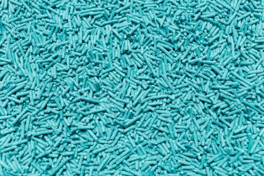 Cyan renginde sağlıklı organik tofu kedi kumları. Doğal soyut arkaplan.