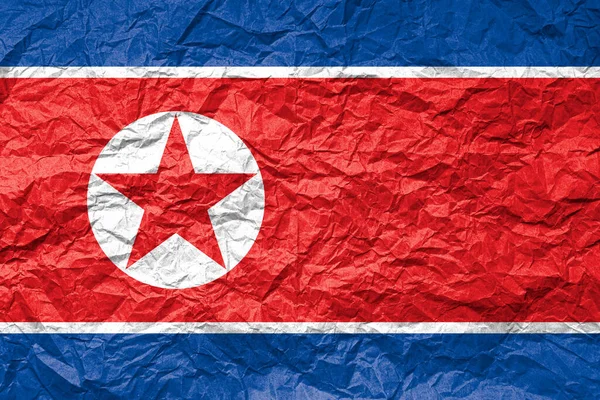 Vlag Van Noord Korea Verkreukeld Papier Getextureerde Achtergrond Rechtenvrije Stockafbeeldingen