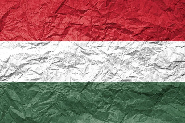 Flag of Hungary on crumpled paper. Textured background.