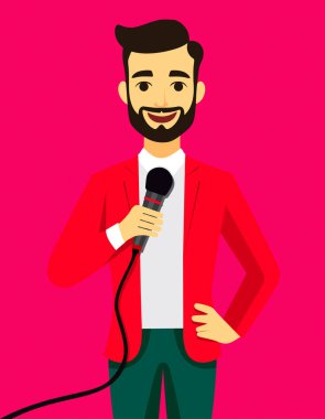 Kırmızı ceketli bir adam mikrofon tutuyor. Gülümsüyor ve bir radyo sunucusu.