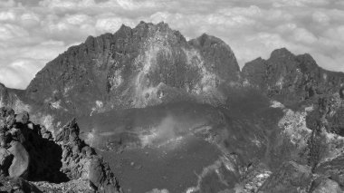 a volcanic crater photographed from above with a black and white photo filter clipart