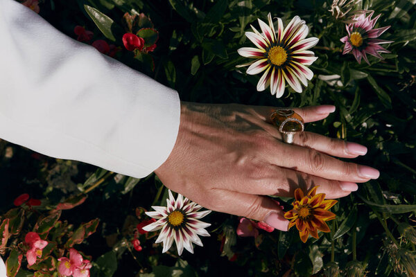Beautiful Hand Adult Woman Jewelry White Jacket Background Flowers Stock Photo