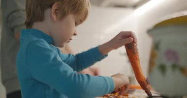Boy Helps To Cook. Kid Prepare Food in Kitchen 4K 10-bit