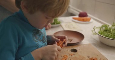 Boy Helps To Cook. Kid Prepare Food in Kitchen 4K 10-bit