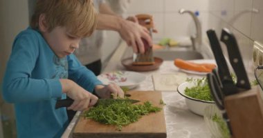 Boy Helps To Cook. Kid Prepare Food in Kitchen 4K 10-bit