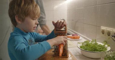 Boy Helps To Cook. Kid Prepare Food in Kitchen 4K 10-bit