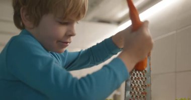 Boy Helps To Cook. Kid Prepare Food in Kitchen 4K 10-bit