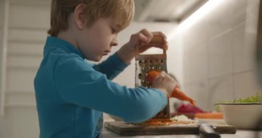 Boy Helps To Cook. Kid Prepare Food in Kitchen 4K 10-bit
