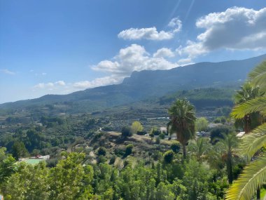 Guadalest Castle (El Castell de Guadalest), under a bright blue sky, is one of Spain's most visited castles, located in the province of Alicante. clipart