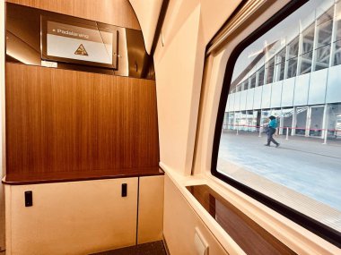 Jakarta, Indonesia - August 20, 2024: Interior of the First Class cabin from inside Whoosh, the Jakarta-Bandung high-speed train (KCIC). clipart