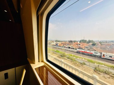 Jakarta, Indonesia - August 20, 2024: Interior of the First Class cabin from inside Whoosh, the Jakarta-Bandung high-speed train (KCIC). clipart