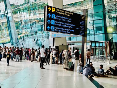 Jakarta, Indonesia - August 25, 2024: The international arrivals terminal at the modern Soekarno Hatta Airport in Jakarta. clipart