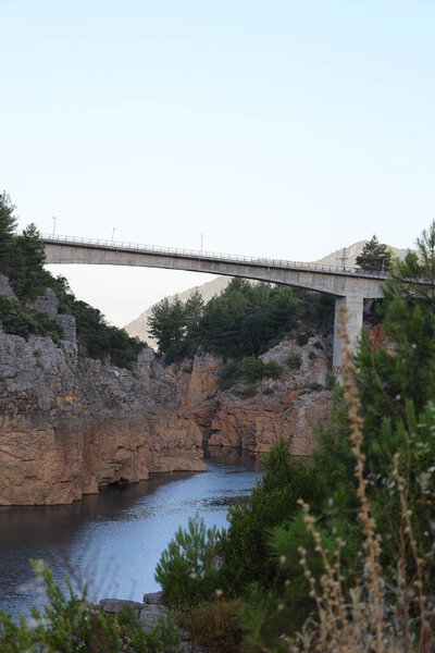Bridge rocky landscape. Mountain reservoir.