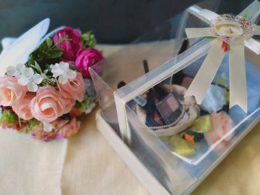 seserahan or wedding gift for groom or bride in indonesian wedding culture. These beautifully crafted wedding gift boxes are adorned with soft floral accents and a soft pearlescent white color. clipart