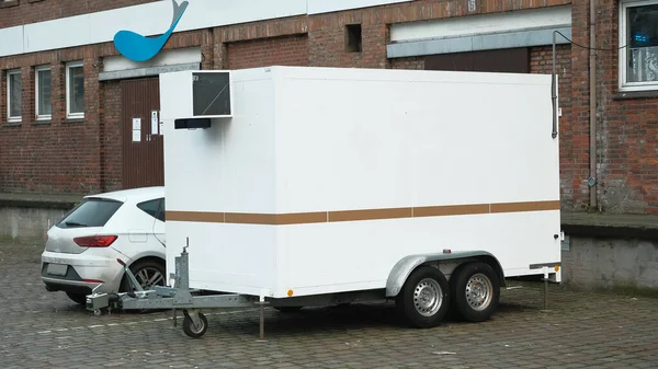 stock image Hamburg, Germany - 03 01 2023: Disengaged white and blank food truck close-up on the street