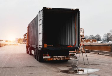 Cargo Truck In The Port. Heavy-Duty Commercial Vehicle. Semitrailer During Loading Of The Cargo. Commercial Vehicle For Shipping And Post Delivery.