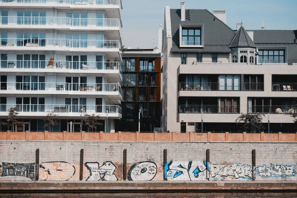 Wroclaw, Poland - 12 September 2023: Modern European Residential Real Estate Apartments Architecture With Broad Terraces And Panoramic Windows With A Walking Area And Walls Painted With Graffiti Art