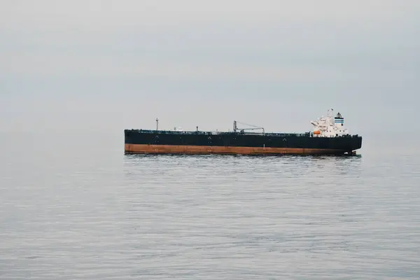 Crude Oil Carrier Tanker At Anchor Making No Way Through The Water