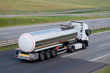 Shiny Road Tanker Truck Transporting Liquid Flammable Cargo clipart