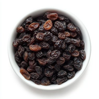 dried black raisins on white background