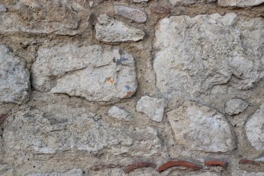 Gri taş duvar ustalarının kabataslak, dokulu yüzeyi vardır. Mimari tasarımlar, inşaat temalı projeler veya kırsal bir arkaplan olarak uygun