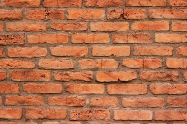 Dış bina için tasarlanmış pürüzsüz bir yüzeyi olan kırmızı tuğla bir duvarın dokusu tamamlanıyor.