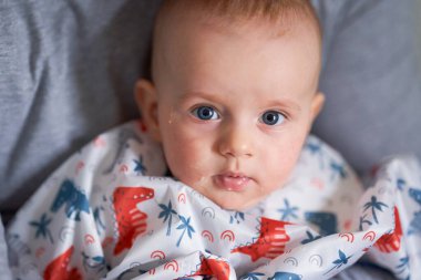 portrait of a boythe first complementary feeding of a six-month-old baby with vegetable purees. High quality photo clipart