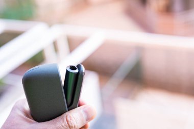 Tarragona, Spain - January 26, 2023: Phillip Morris Internationals Marlboro IQOS, electronic cigarette. Box new iluma.