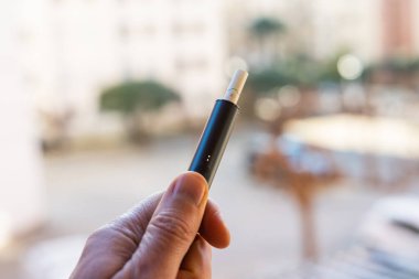 Tarragona, Spain - January 26, 2023: Phillip Morris Internationals Marlboro IQOS, electronic cigarette. Box new iluma.