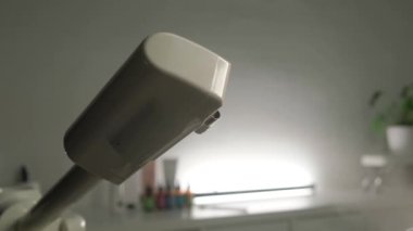 Steaming the skin of the face close-up before cleaning the skin in a beauty salon.