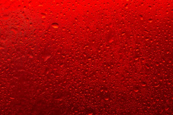 Υφή Μιας Σταγόνας Νερού Ένα Κόκκινο Φόντο Close — Φωτογραφία Αρχείου