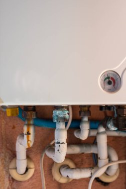 Rusty pipe on a gas boiler close-up.