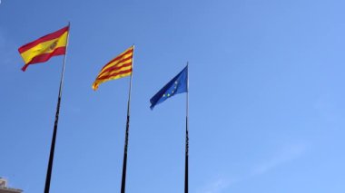 Flags spain european union catalonia on blue sky background