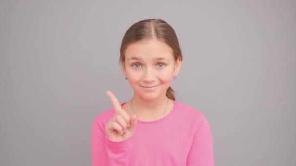 Sign Gesture Teenage Girl Shows Finger Studio Gray Background — Stock Video