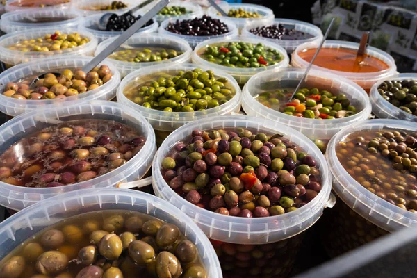 Pickled olives of different varieties at the bazaar.