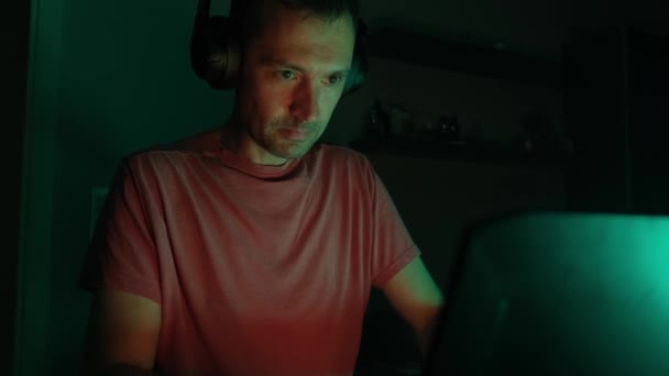 Adult Male Gamer Headphones Plays Laptop Dark Room — Stock Video