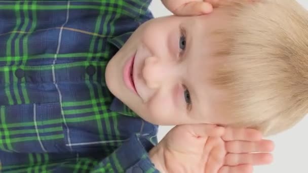 Happy Little Boy Rejoices Shows Positive Emotions Close Portrait Vertical — Stock Video