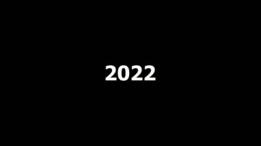 2022, 2023 ve 2004 numaralarının animasyonu. Siyah zemin üzerinde beyaz sayılar bulunan yeni yıl takvimi.