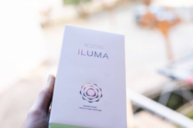 Tarragona, Spain - January 26, 2023: Phillip Morris Internationals Marlboro IQOS, electronic cigarette. Box new iluma.