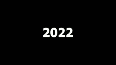 2022, 2023 ve 2004 numaralarının animasyonu. Siyah zemin üzerinde beyaz sayılar bulunan yeni yıl takvimi.