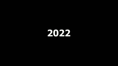 2022, 2023 ve 2004 numaralarının animasyonu. Siyah zemin üzerinde beyaz sayılar bulunan yeni yıl takvimi.