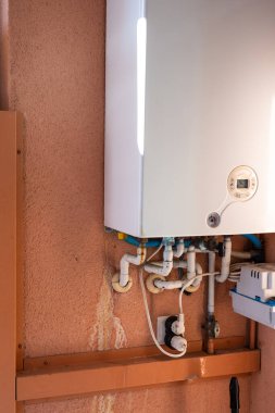 Rusty pipe on a gas boiler close-up.