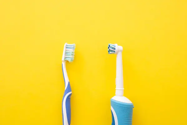 Electric Toothbrush Yellow Background Old New Dental Account Royalty Free Stock Photos
