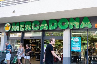 Tarragona, Spain - February 02 2023: Mercadona supermarket logo on blue sky background.
